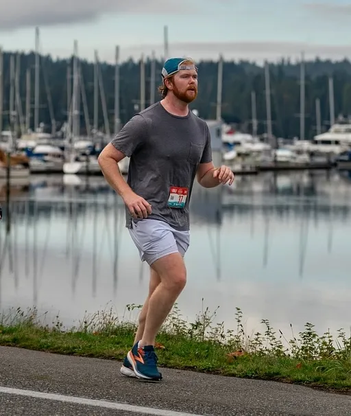 Me running a half with a bay in the background